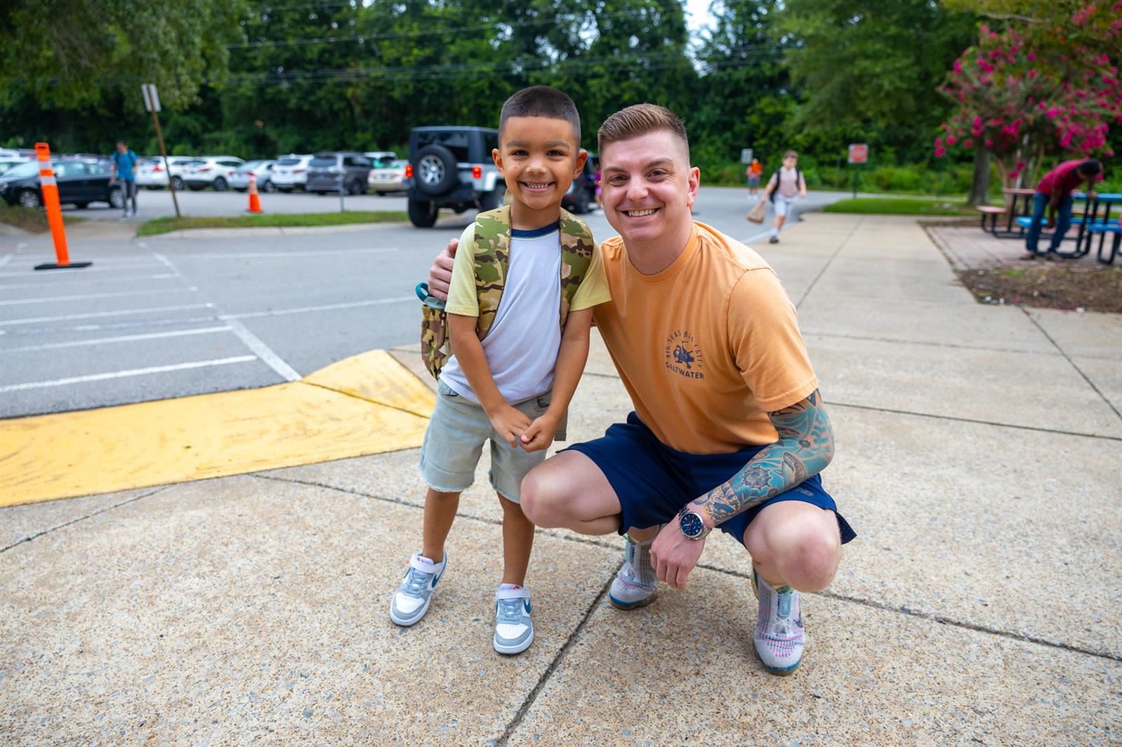 dad and son on sidewalk